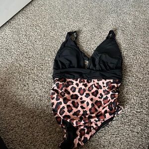 Black and tan one piece swim suit